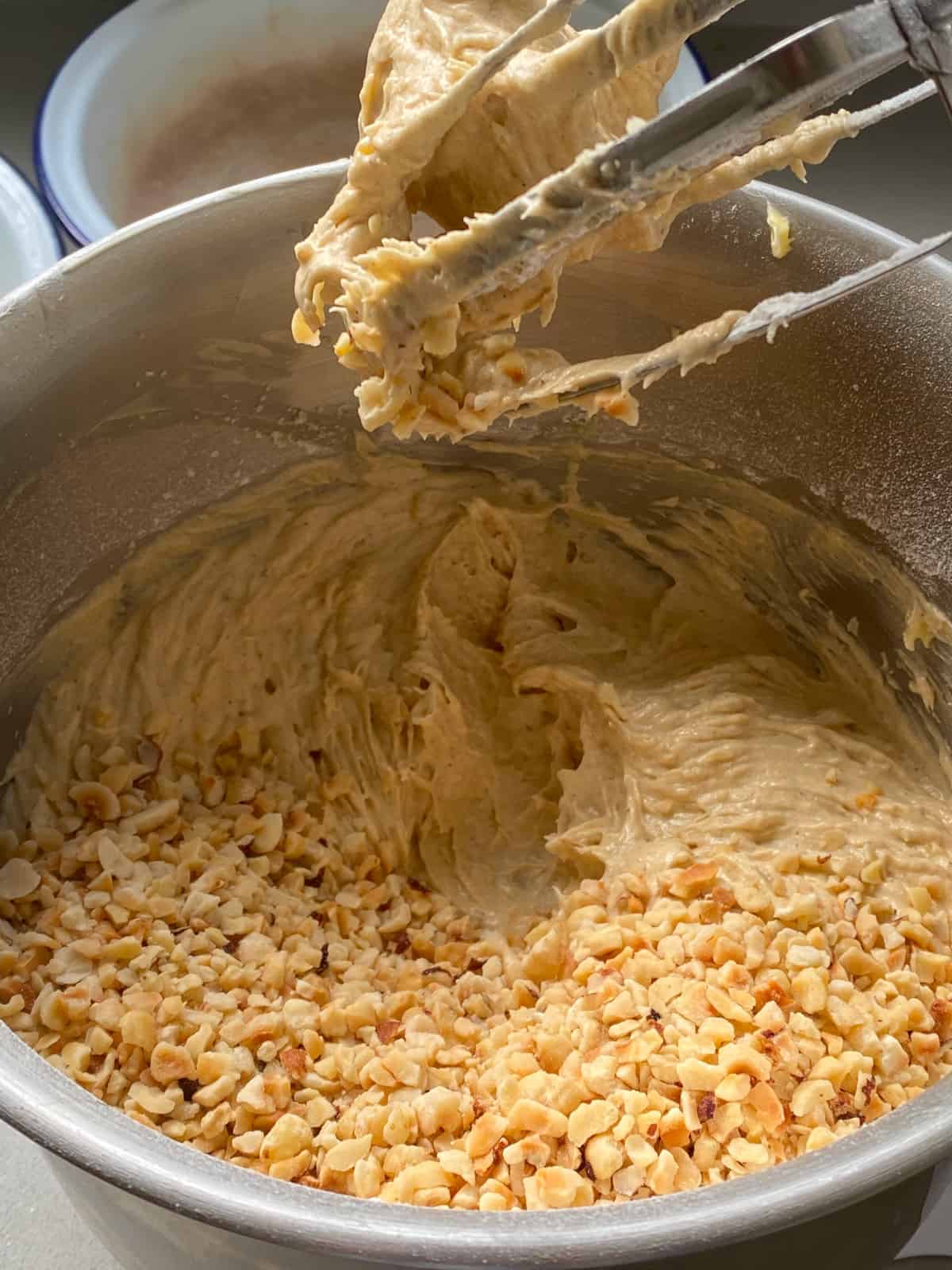 Adding nuts to the cake batter.