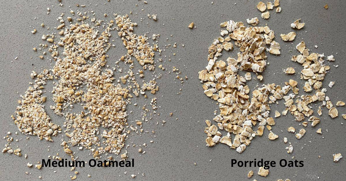 Medium Oats and Porridge oats scattered onto a counter top.