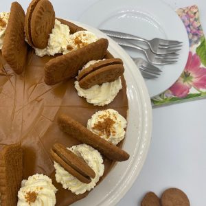 Biscoff cheesecake on a white plate.