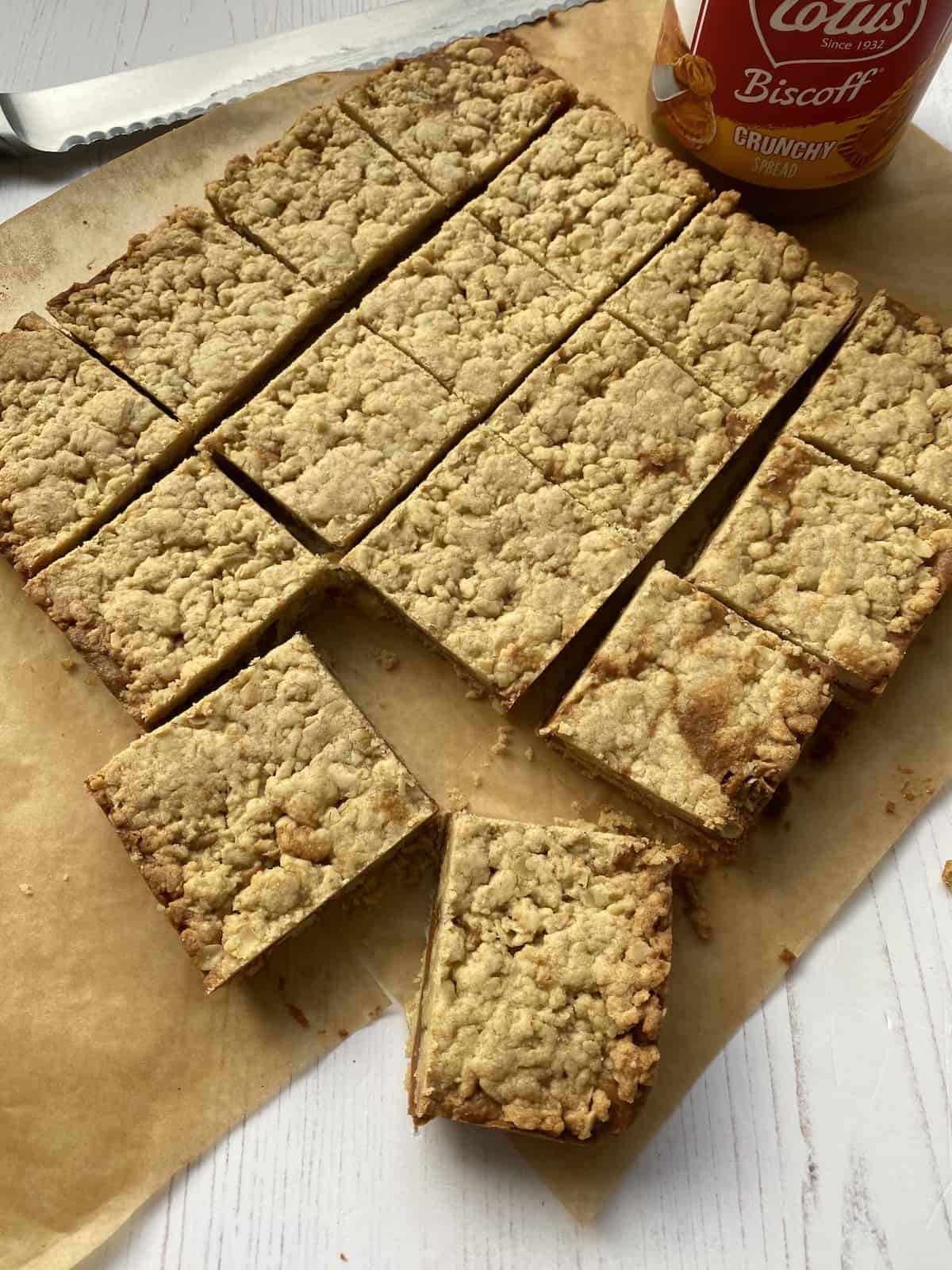 Slices of Biscoff Bites on baking parchment.