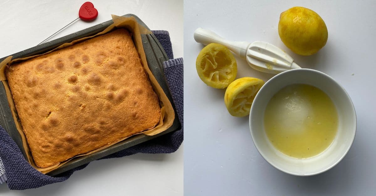 Baked Lemon Drizzle Traybake in a baking tin with a blue tea towel underneath the tin.
