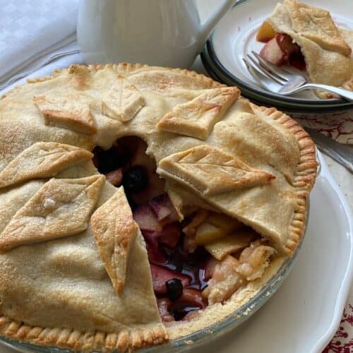 Apple Pie with shortcrust pastry with a slice cut out.