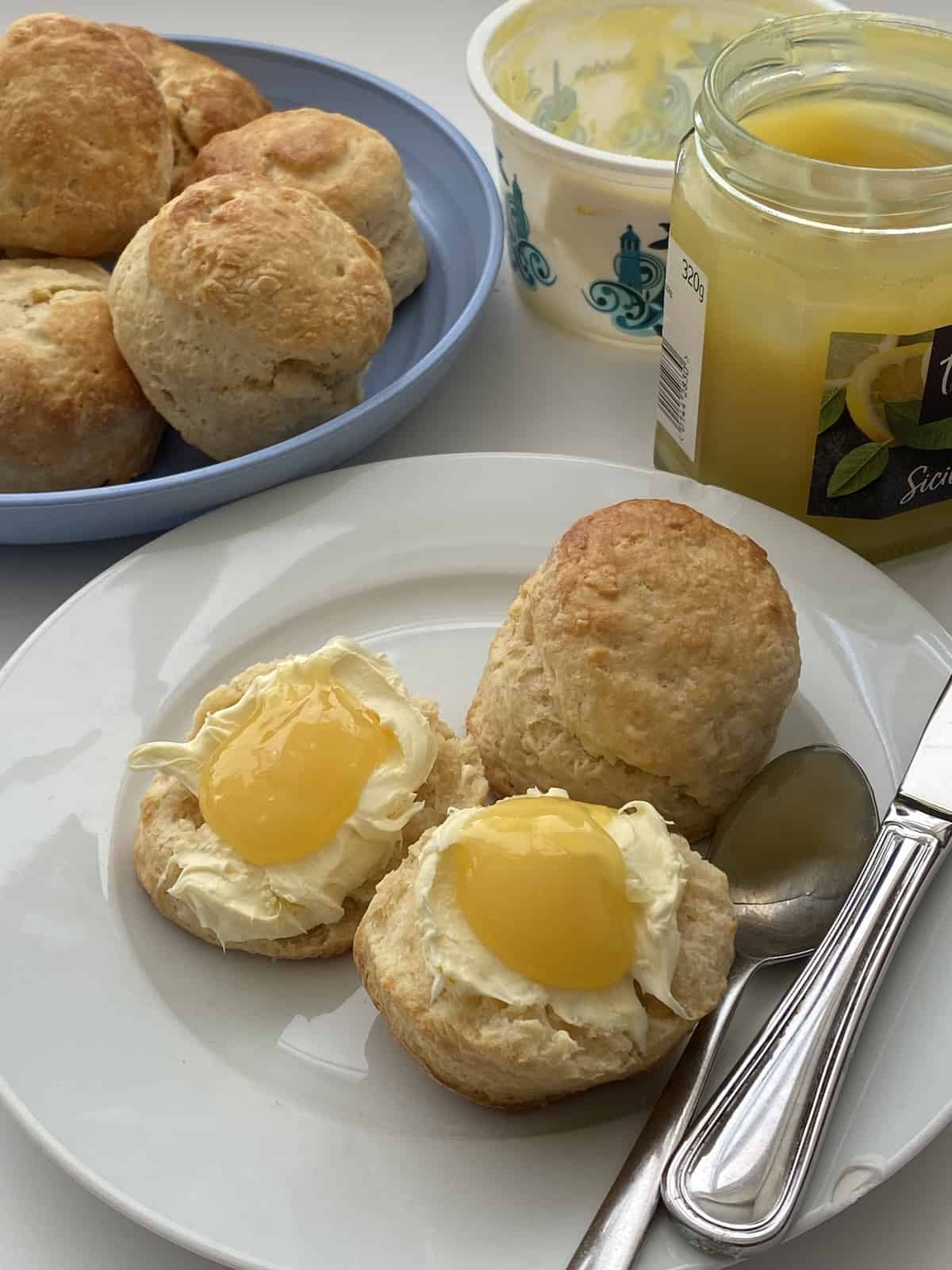 Plate of egg free scones with cream and Lemon Curd.